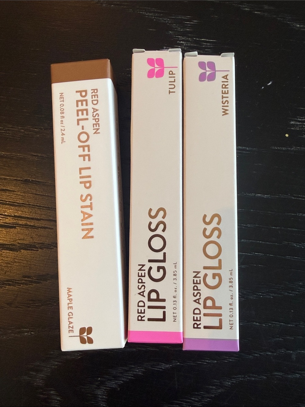 Red Aspen Lip Stain and 2 Lip Gloss- new in box.